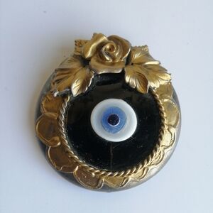 Small Gold Floral framed glass Evil Eye wall art.